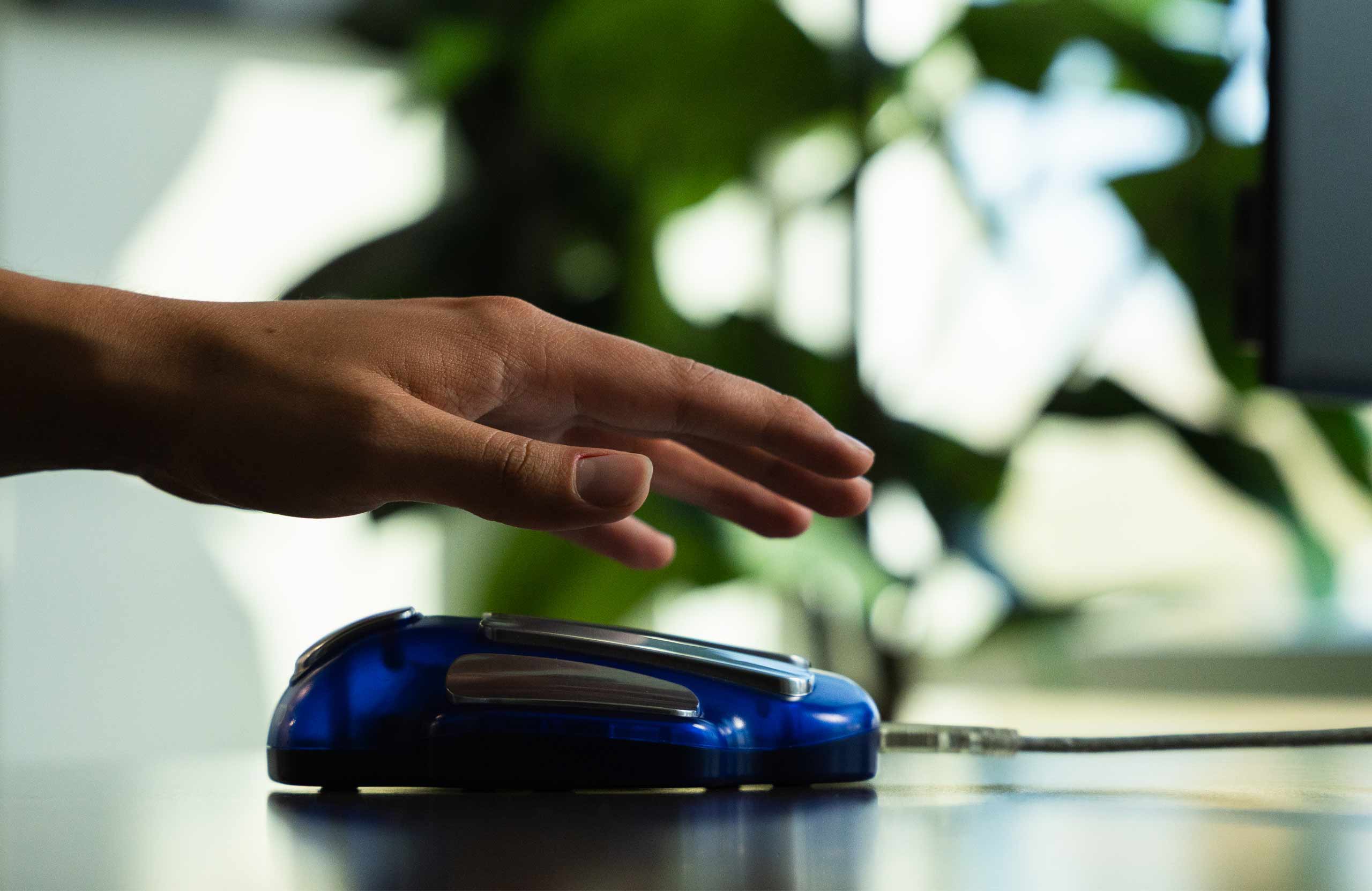 A wellness scan consult with a handheld sensor and an elegant report on a tablet